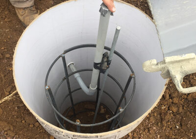 Concrete base for pole lighting repairs in a commercial parking lot